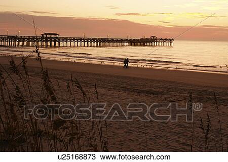 Stock Image -  Myrtle Beach, SC, South Carolina, The Grand Strand, beach, sunrise, fishing pier. Fotosearch
