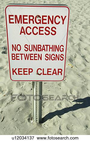 Stock Photo -  Myrtle Beach, SC, South Carolina, The Grand Strand, Emergency access sign, No Sunbathing Between signs Keep Clear. Fotosearch