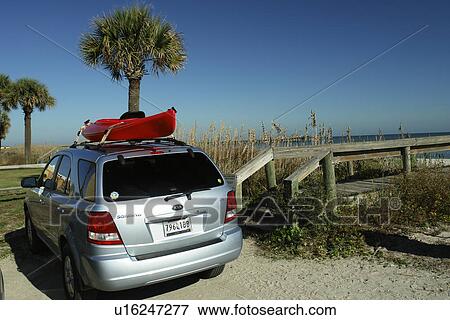 Stock Photo -  Myrtle Beach, SC, South Carolina, The Grand Strand, car, kayak, parking lot, beach. Fotosearch