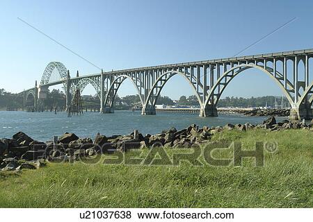 Stock Photo -  Newport, OR, Oregon, Pacific Ocean, Pacific Coast Scenic Byway, Rt Route, Highway 101, Yaquina Bay River, Yaquina Bay Bridge. Fotosearch
