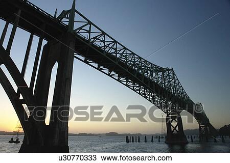 Stock Image -  North Bend, OR, Oregon, Pacific Ocean, Pacific Coast Scenic Byway, Rt Route, Highway 101, Conde B. McCullough Memorial Bridge, Coos Bay, cantilever bridge. Fotosearch
