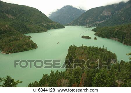 Stock Photo -  North Cascades, WA, Washington, Okanogan National Forest, Ross Lake National Recreation Area, National Park Service Complex, Diablo Lake, overlook. Fotosearch