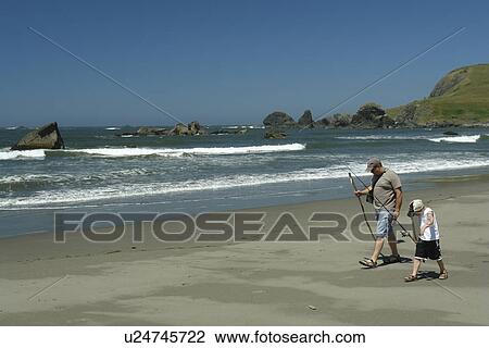 OR, Oregon, Pacific Ocean, Pacific Coast Scenic Byway, Rt Route, Highway 101, Samuel H. Boardman Scenic Corridor, Sea Stacks, father and son walking on the beach with fishing pole View Large Photo Image Stock Image - OR, Oregon, Pacific Ocean, Pacific Coast Scenic Byway, Rt Route, Highway 101, Samuel H. Boardman Scenic Corridor, Sea Stacks, father and son walking on the beach with fishing pole. Fotosearch