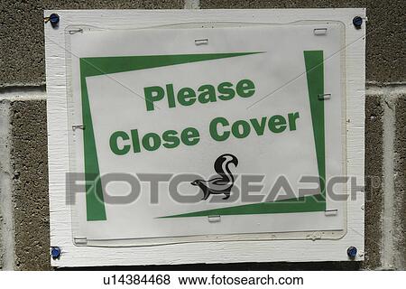 Stock Photo -  OR, Oregon, Please Close Cover, latrine, smell, outhouse sign. Fotosearch