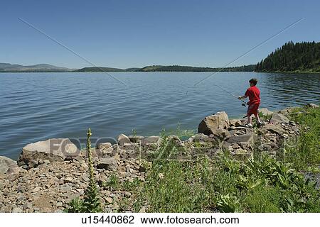Stock Image -  OR, Oregon, Upper Klamath Lake, boy fishing. Fotosearch