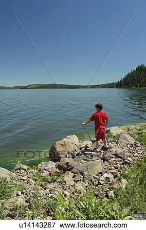 OR, Oregon, Upper Klamath Lake, boy fishing View Large Photo Image Stock Photo -  OR, Oregon, Upper Klamath Lake, boy fishing. Fotosearch