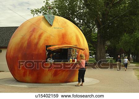Stock Photo -  Penticton, Okanagan Valley, British Columbia, Canada, snack stand shaped like a peach. Fotosearch