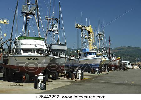 Stock Image -  Port Orford, OR, Oregon, Pacific Ocean, Pacific Coast Scenic Byway, Rt Route, Highway 101, fishing boats, dry dock. Fotosearch