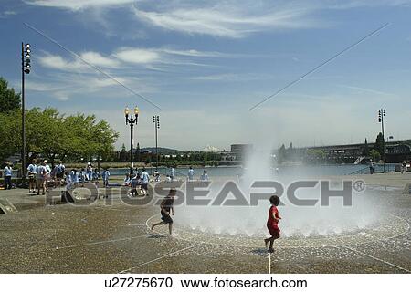 Stock Image -  Portland, OR, Oregon, downtown, Salmon Street Springs, fountain. Fotosearch
