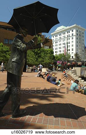 Portland, OR, Oregon, downtown, Pioneer Courthouse Square, Allow Me statue, bronze statue of man with umbrella View Large Photo Image Stock Photo - Portland, OR, Oregon, downtown, Pioneer Courthouse Square, Allow Me statue, bronze statue of man with umbrella. Fotosearch