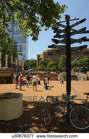 Stock Photo -  Portland, OR, Oregon, downtown, Pioneer Courthouse Square, mileage post, signs. Fotosearch