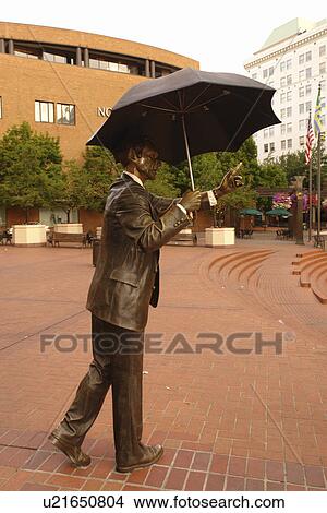 Picture -  Portland, OR, Oregon, Pioneer Courthouse Square, man with umbrella statue. Fotosearch