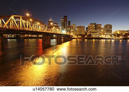 Stock Image -  Portland, OR, Oregon, Willamette River, Hawthorne Lift Bridge, downtown, skyline, evening. Fotosearch