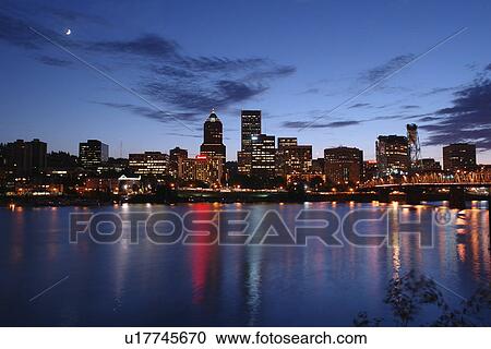 Stock Image -  Portland, OR, Oregon, Willamette River, Hawthorne Lift Bridge, downtown, skyline, evening. Fotosearch