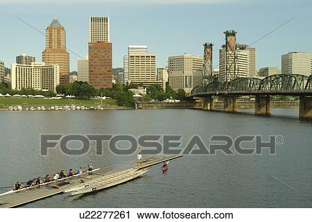 Stock Image -  Portland, OR, Oregon, Willamette River, Hawthorne Lift Bridge, downtown, skyline, rowing teams, scull. Fotosearch