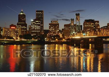 Stock Image -  Portland, OR, Oregon, Willamette River, Hawthorne Lift Bridge, downtown, skyline, evening. Fotosearch