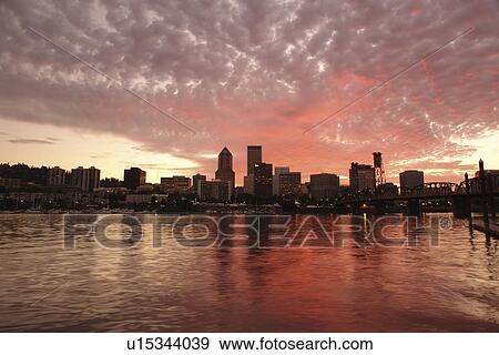Stock Photo -  Portland, OR, Oregon, Willamette River, downtown, skyline, sunset. Fotosearch