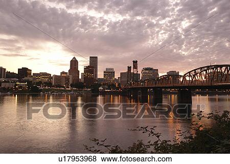 Stock Photo -  Portland, OR, Oregon, Willamette River, Hawthorne Lift Bridge, downtown, skyline, sunset. Fotosearch