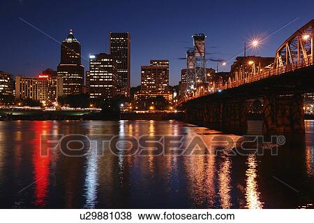 Stock Photo -  Portland, OR, Oregon, Willamette River, Hawthorne Lift Bridge, downtown, skyline, evening. Fotosearch