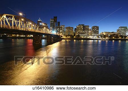 Stock Photograph -  Portland, OR, Oregon, Willamette River, Hawthorne Lift Bridge, downtown, skyline, evening. Fotosearch