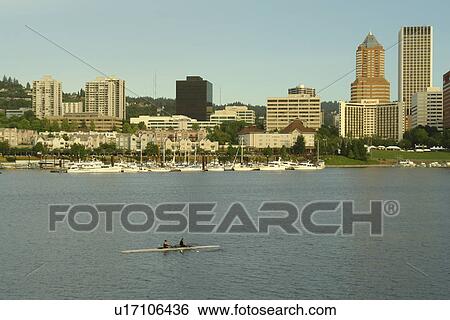 Stock Photograph -  Portland, OR, Oregon, Willamette River, Hawthorne Lift Bridge, downtown, skyline, rowing teams, scull. Fotosearch