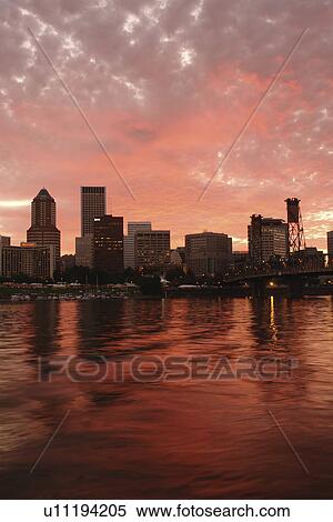 Stock Photography -  Portland, OR, Oregon, Willamette River, downtown, skyline, sunset. Fotosearch