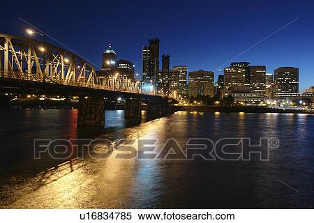 Stock Photography -  Portland, OR, Oregon, Willamette River, Hawthorne Lift Bridge, downtown, skyline, evening. Fotosearch