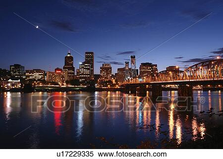 Stock Photography -  Portland, OR, Oregon, Willamette River, Hawthorne Lift Bridge, downtown, skyline, evening. Fotosearch