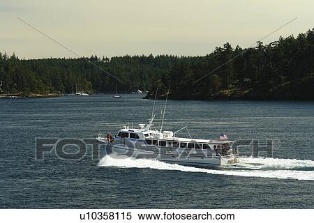 Stock Photography -  San Juan Island, WA, Washington, Puget Sound, San Juan Islands, Friday Harbor, Washington State ferry to British Columbia, Canada, tour boat. Fotosearch