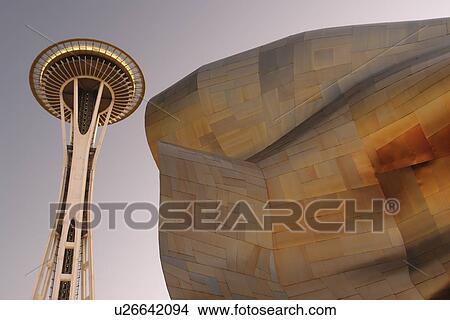 Picture -  Seattle, WA, Washington, Seattle Center, Space Needle, Experiment Music Project, Frank O. Gehry designed building, evening. Fotosearch