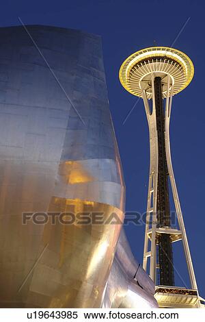Stock Photography -  Seattle, WA, Washington, Seattle Center, Space Needle, Experiment Music Project, Frank O. Gehry designed building, evening. Fotosearch