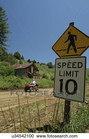 Silver City, ID, Idaho, Ghost Town, pedestrian crossing sign full of bullet holes, speed limit sign, 10 miles per hour, dirt road, ATV View Large Photo Image Stock Image - Silver City, ID, Idaho, Ghost Town, pedestrian crossing sign full of bullet holes, speed limit sign, 10 miles per hour, dirt road, ATV. Fotosearch