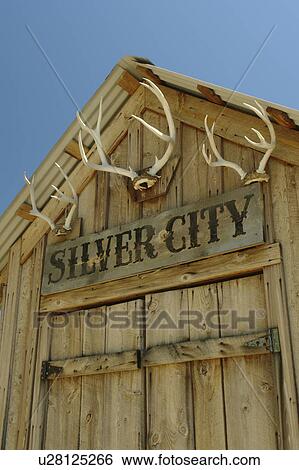 Stock Photograph -  Silver City, ID, Idaho, Ghost Town, Owyhee Mountains, antlers on building. Fotosearch
