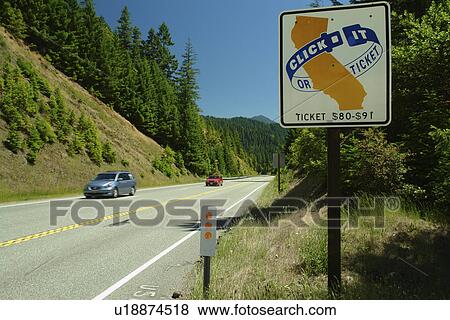 Stock Photo -  Smith River National Recreation Area, CA, California, Six Rivers National Forest Scenic Byway, Rt. 199, Click it or Ticket road sign, seat belt safety. Fotosearch