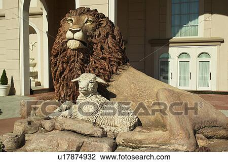 Stock Image -  Strasburg, PA, Pennsylvania, Pennsylvania Dutch Country, Sight & Sound Millennium Theatre, Lion & Lamb Statue. Fotosearch