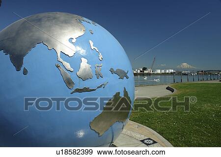 Stock Photo -  Tacoma, WA, Washington, Puget Sound, Commencement Bay, Tacoma Harbor, sculpture of the globe at Thea's Park. Fotosearch