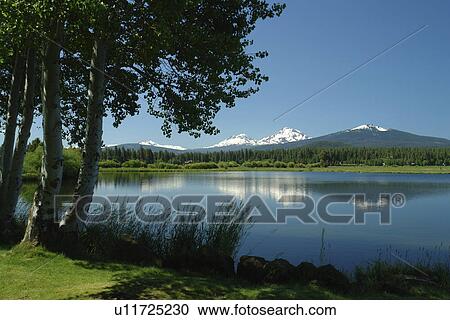 Stock Image -  Three Sisters, OR, Oregon, Black Butte Ranch, lake, Cascade Range, Cascade Volcanic Belt. Fotosearch