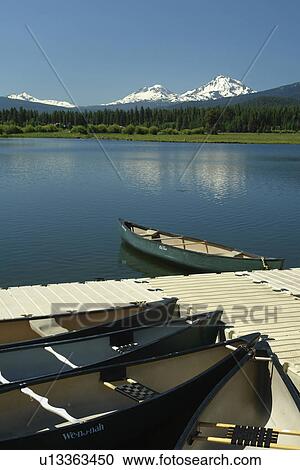 Stock Image -  Three Sisters, OR, Oregon, Black Butte Ranch, lake, boats, Cascade Range, Cascade Volcanic Belt. Fotosearch