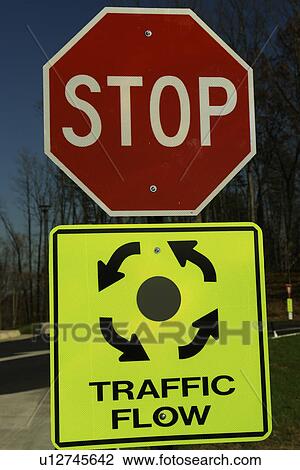 Stock Image -  Triangle, VA, Virginia, Stop sign, round about, circle, traffic flow, road signs. Fotosearch