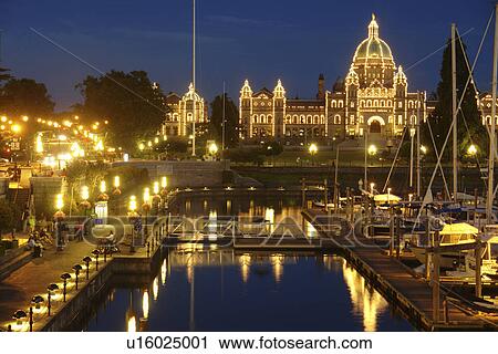 Stock Image -  Victoria, British Columbia, Canada, Vancouver Island, Inner Harbour, Parliament Buildings, waterfront, marina, evening. Fotosearch