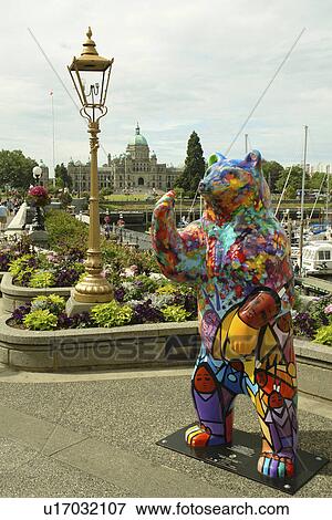 Stock Photo -  Victoria, British Columbia, Canada, Vancouver Island, Inner Harbour, downtown skyline, waterfront, Spirit Bears in the City, Good News Bear bear statue. Fotosearch