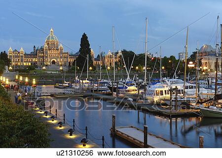 Stock Photograph -  Victoria, British Columbia, Canada, Vancouver Island, Inner Harbour, Parliament Buildings, waterfront, marina, evening. Fotosearch