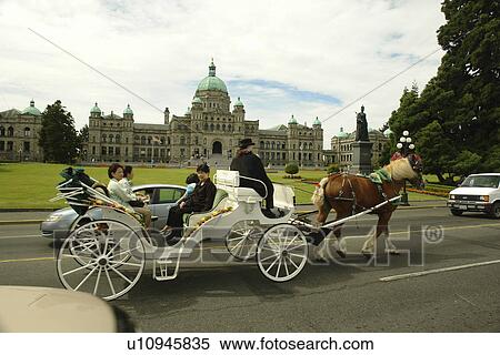 Stock Photography -  Victoria, British Columbia, Canada, Vancouver Island, Inner Harbour, Parliament Buildings, horse-drawn carriage ride. Fotosearch