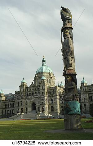 Stock Photography -  Victoria, British Columbia, Canada, Vancouver Island, Parliament Buildings, totem pole. Fotosearch