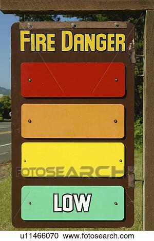 Stock Image -  Waldport, OR, Oregon, Pacific Ocean, Pacific Coast Scenic Byway, Rt Route, Highway 101, Fire Danger Sign. Fotosearch