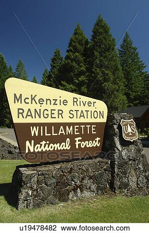 Stock Image -  Willamette National Forest, OR, Oregon, Cascade Range, McKenzie River Ranger Station, West Cascades Scenic Byway, wooden road sign. Fotosearch