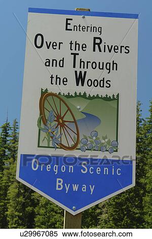 Stock Photography -  Willamette National Forest, OR, Oregon, Cascade Range, Oregon Scenic Byway, Entering Over the Rivers and Through the Woods, road sign. Fotosearch