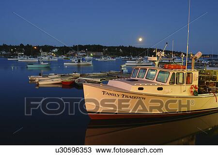 Stock Image -  Bass Harbor/Bernard, ME, Maine, Mt Desert Island, fishing harbor, evening, moonrise. Fotosearch