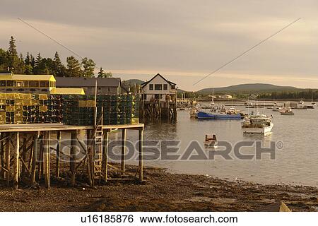 Stock Photograph -  Bernard/Bass Harbor, ME, Maine, fishing harbor, low tide, lobster traps. Fotosearch