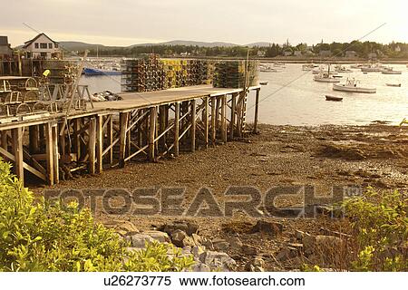 Stock Photography -  Bernard/Bass Harbor, ME, Maine, fishing harbor, low tide, lobster traps. Fotosearch
